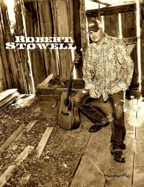 Robert Stowell country artist portrait with acoustic guitar